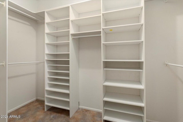 spacious closet with tile patterned flooring