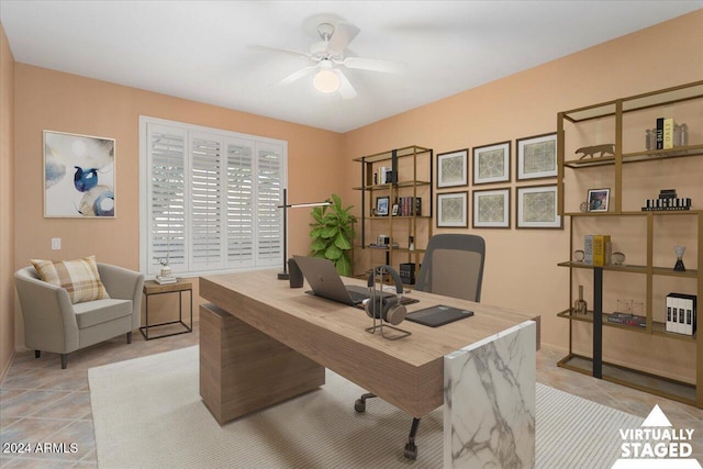 office featuring light tile patterned floors and a ceiling fan