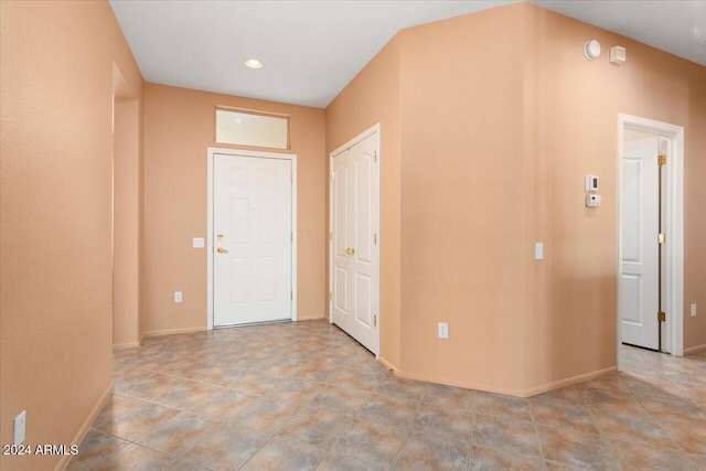 interior space with recessed lighting and baseboards