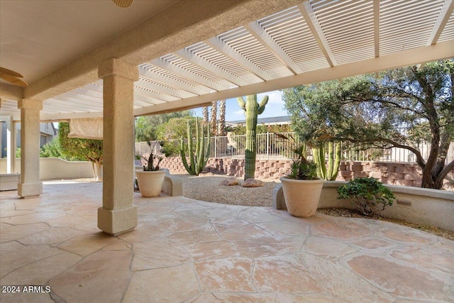 view of patio / terrace featuring fence and a pergola