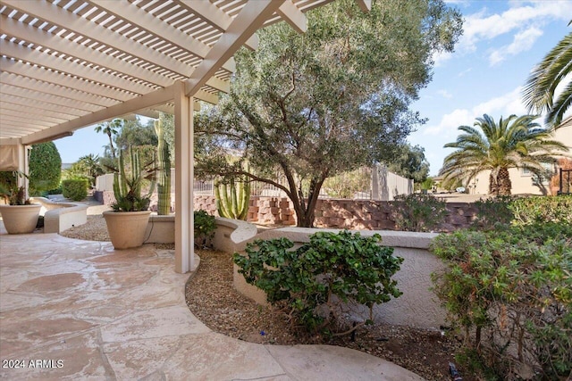 view of patio / terrace with fence and a pergola