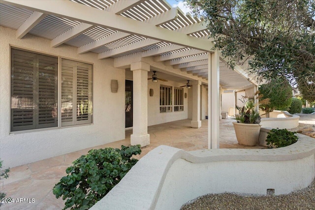 view of patio with a ceiling fan and a pergola