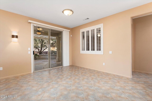 empty room featuring visible vents and baseboards