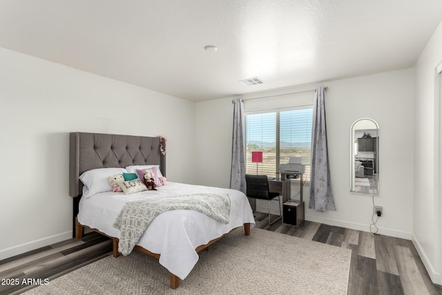 bedroom featuring hardwood / wood-style flooring