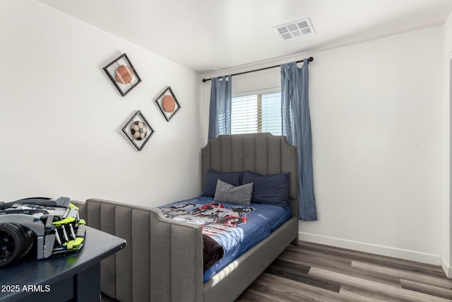 bedroom featuring dark wood-type flooring