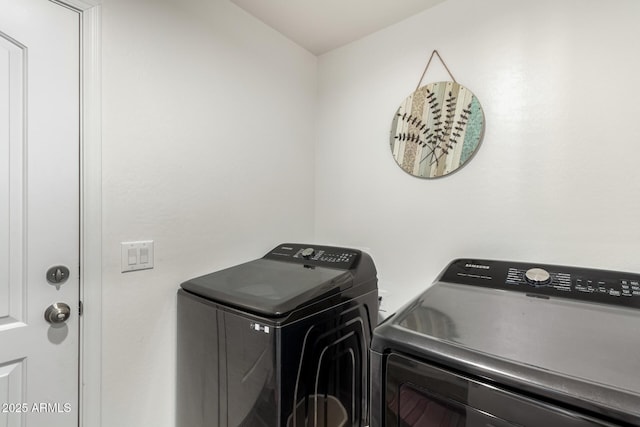 washroom with separate washer and dryer