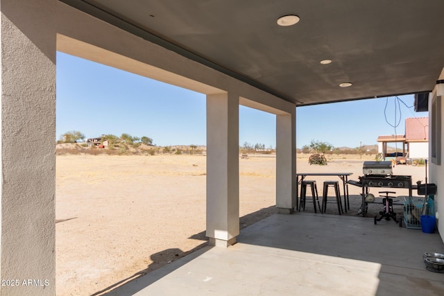 view of patio with a grill