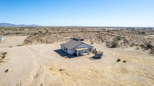 drone / aerial view featuring a mountain view