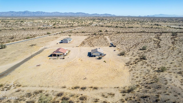 birds eye view of property with a mountain view