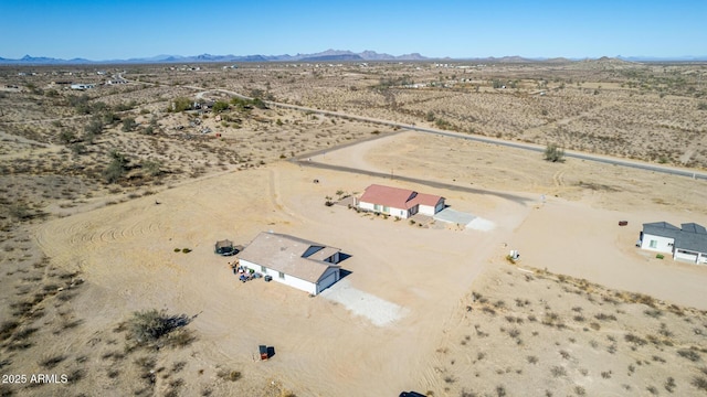 birds eye view of property featuring a mountain view