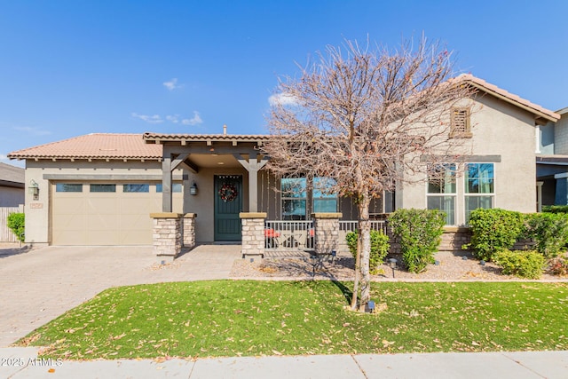 mediterranean / spanish house with a garage and a front lawn