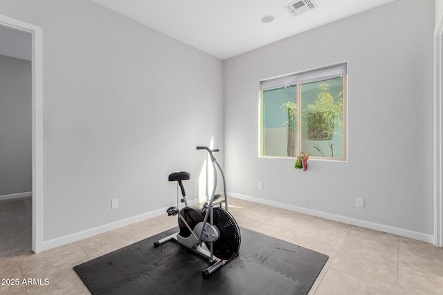 workout room featuring light tile patterned floors