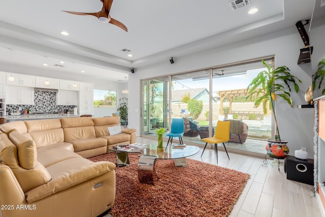 living room featuring ceiling fan