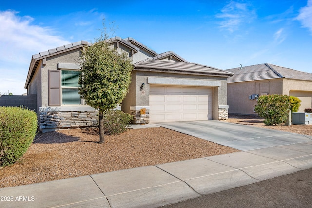 ranch-style home with driveway, a garage, stone siding, a tiled roof, and stucco siding