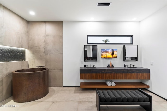 bar featuring a sink, visible vents, wet bar, and recessed lighting