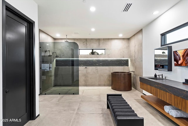 full bathroom with vanity, recessed lighting, a walk in shower, and visible vents