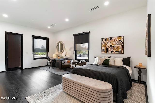 bedroom with dark wood-type flooring, recessed lighting, visible vents, and baseboards