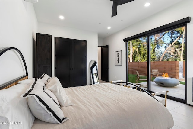 bedroom featuring recessed lighting and access to outside