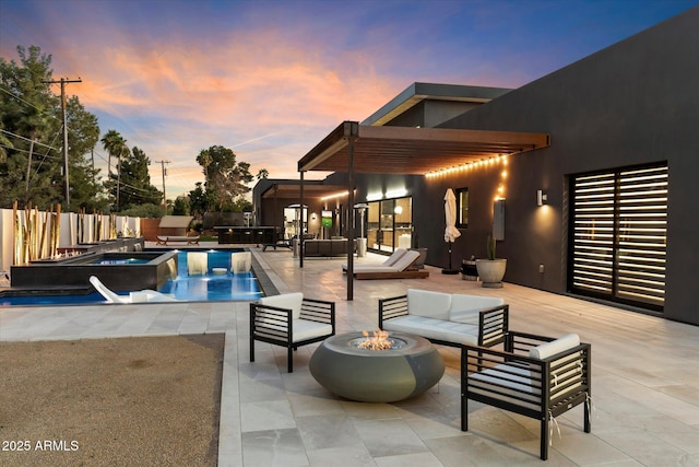 view of pool featuring a fenced backyard, an outdoor living space with a fire pit, a fenced in pool, an in ground hot tub, and a patio area