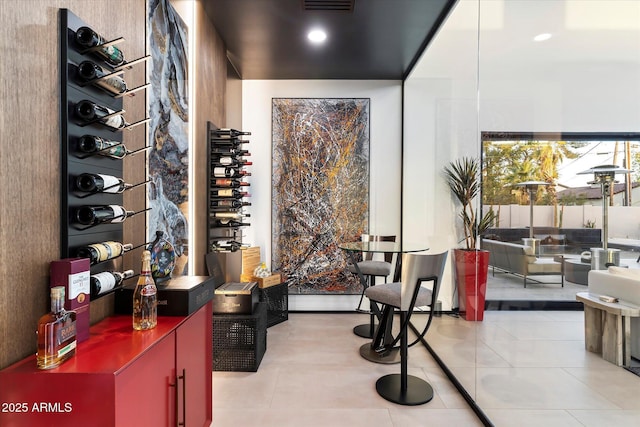 wine room with tile patterned flooring and visible vents