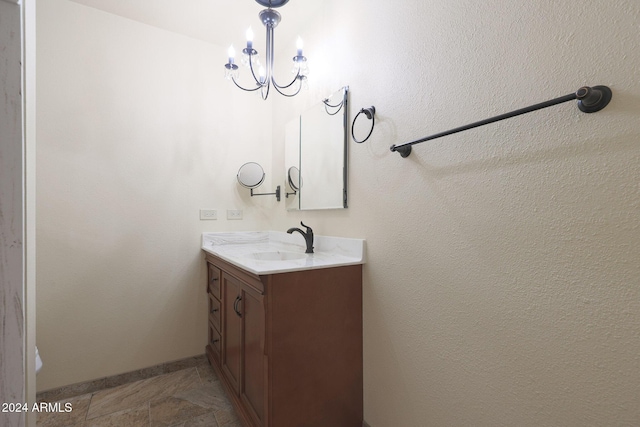 bathroom featuring vanity and an inviting chandelier