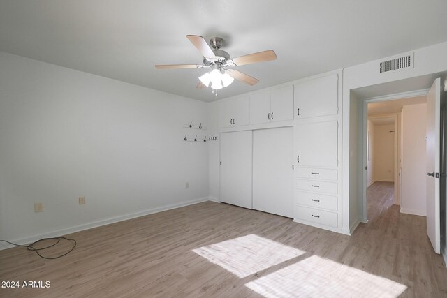 unfurnished bedroom featuring a closet, ceiling fan, and light hardwood / wood-style flooring