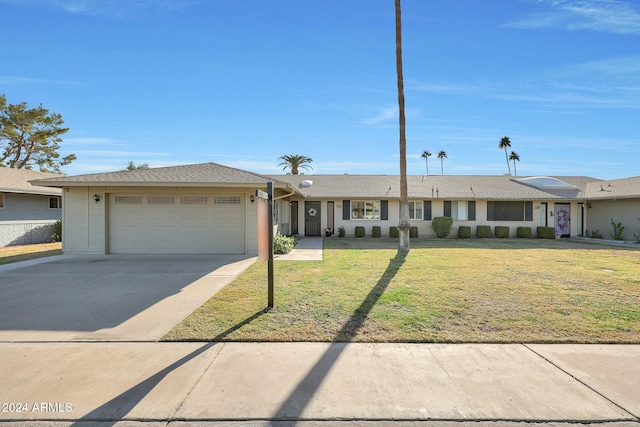 single story home with a garage and a front yard