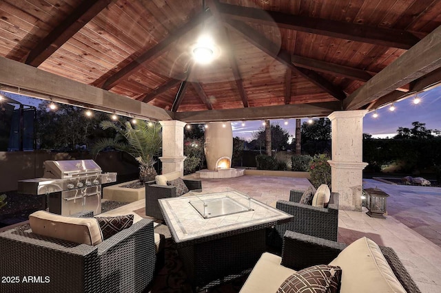 10365 E Paradise Dr, Scottsdale, AZ 85260 - patio terrace at dusk featuring a gazebo and an outdoor hangout area
