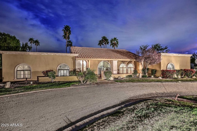 10365 E Paradise Dr, Scottsdale, AZ 85260 - mediterranean / spanish home featuring a tiled roof and stucco siding
