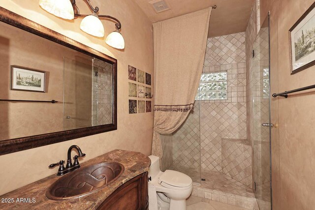 10365 E Paradise Dr, Scottsdale, AZ 85260 - bathroom featuring visible vents, toilet, a stall shower, and vanity