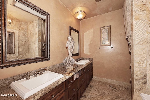 10365 E Paradise Dr, Scottsdale, AZ 85260 - full bathroom with a sink, baseboards, marble finish floor, and double vanity