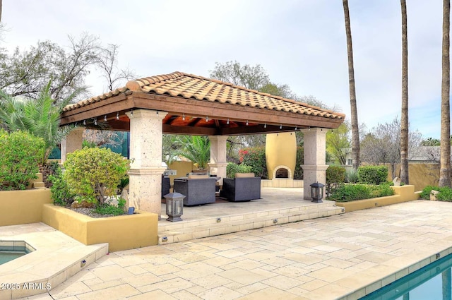 10365 E Paradise Dr, Scottsdale, AZ 85260 - view of patio / terrace with a gazebo and exterior fireplace