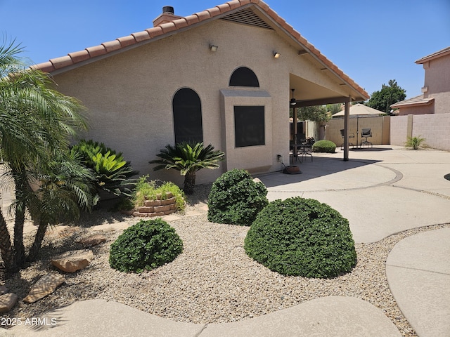 7724 W Topeka Dr W, Glendale, AZ 85308 - view of front facade featuring a patio, a tiled roof, and stucco siding