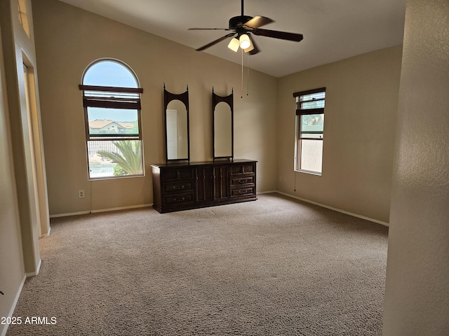 7724 W Topeka Dr W, Glendale, AZ 85308 - unfurnished bedroom with lofted ceiling, carpet floors, baseboards, and ceiling fan