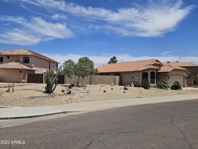 7724 W Topeka Dr W, Glendale, AZ 85308 - view of yard featuring a garage and driveway