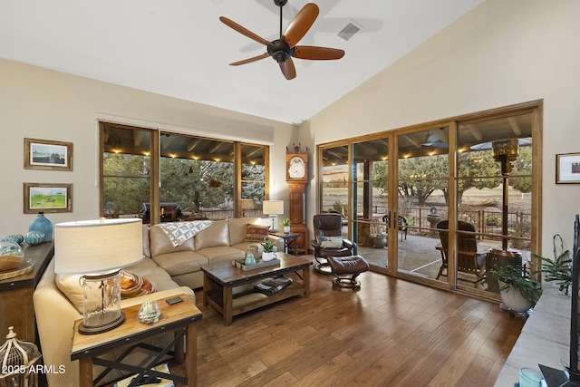 living room with french doors, ceiling fan, high vaulted ceiling, and hardwood / wood-style floors