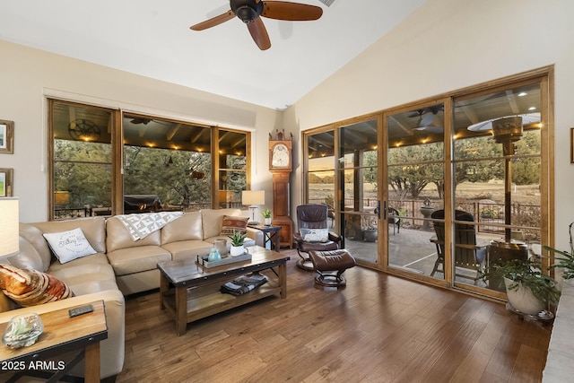 sunroom with lofted ceiling and ceiling fan