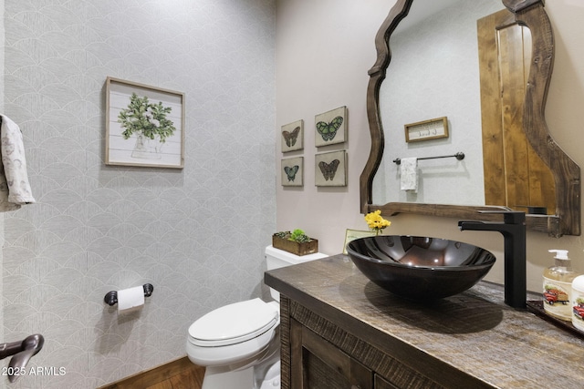 bathroom with vanity and toilet