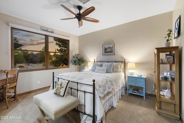 bedroom featuring ceiling fan and light carpet