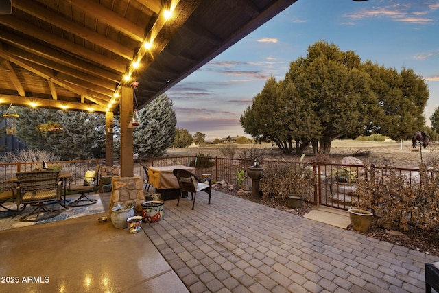 view of patio terrace at dusk