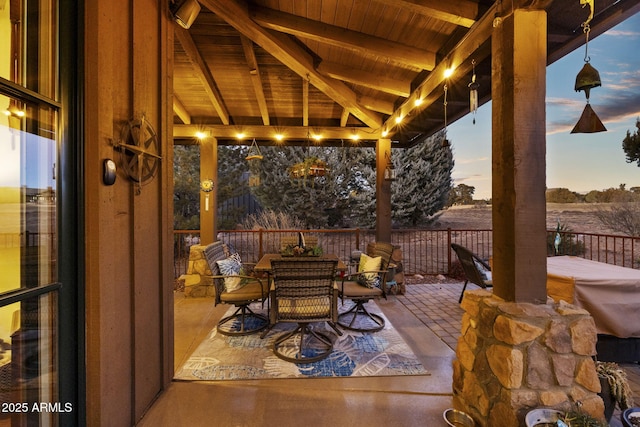 view of patio terrace at dusk