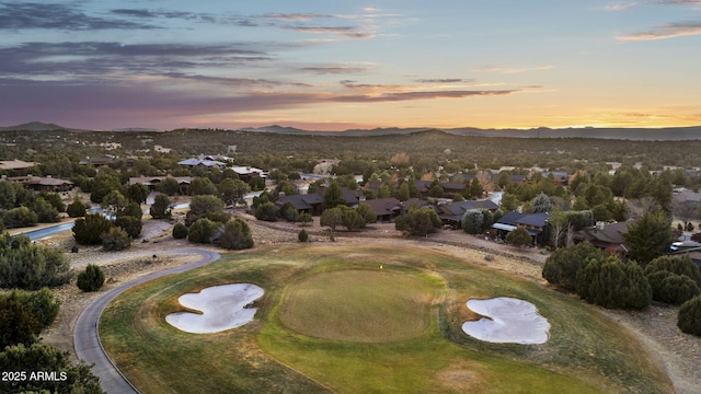 aerial view at dusk featuring a mountain view