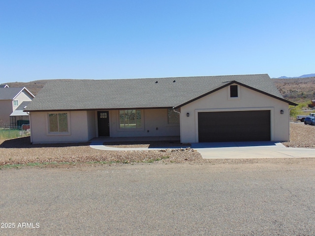 17707 E Jackrabbit Rd, Mayer, AZ 86333 - ranch-style house with driveway, a garage, and roof with shingles