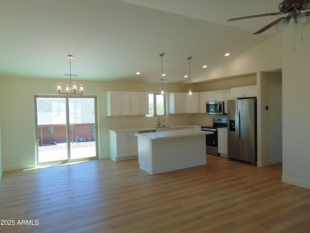 17707 E Jackrabbit Rd, Mayer, AZ 86333 - kitchen featuring appliances with stainless steel finishes, recessed lighting, a kitchen island, a sink, and white cabinetry