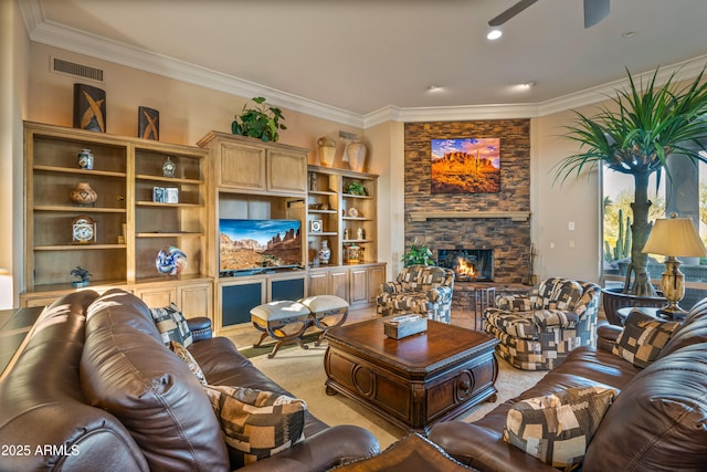 living room with a fireplace, ceiling fan, and crown molding