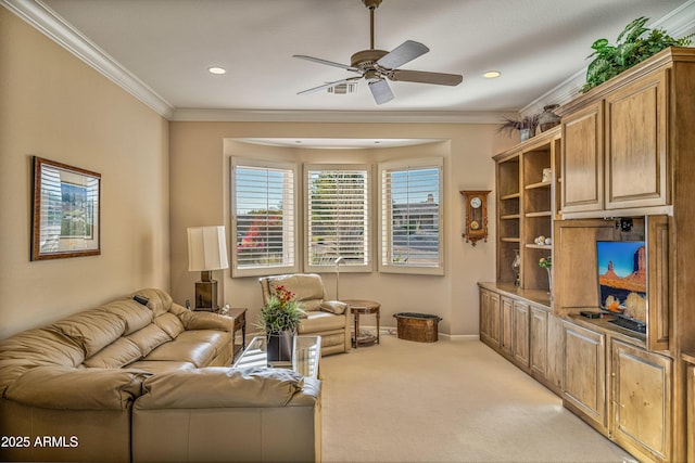 living room with ceiling fan, light colored carpet, and ornamental molding