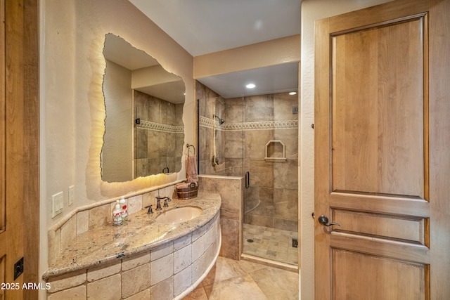 bathroom featuring vanity and an enclosed shower