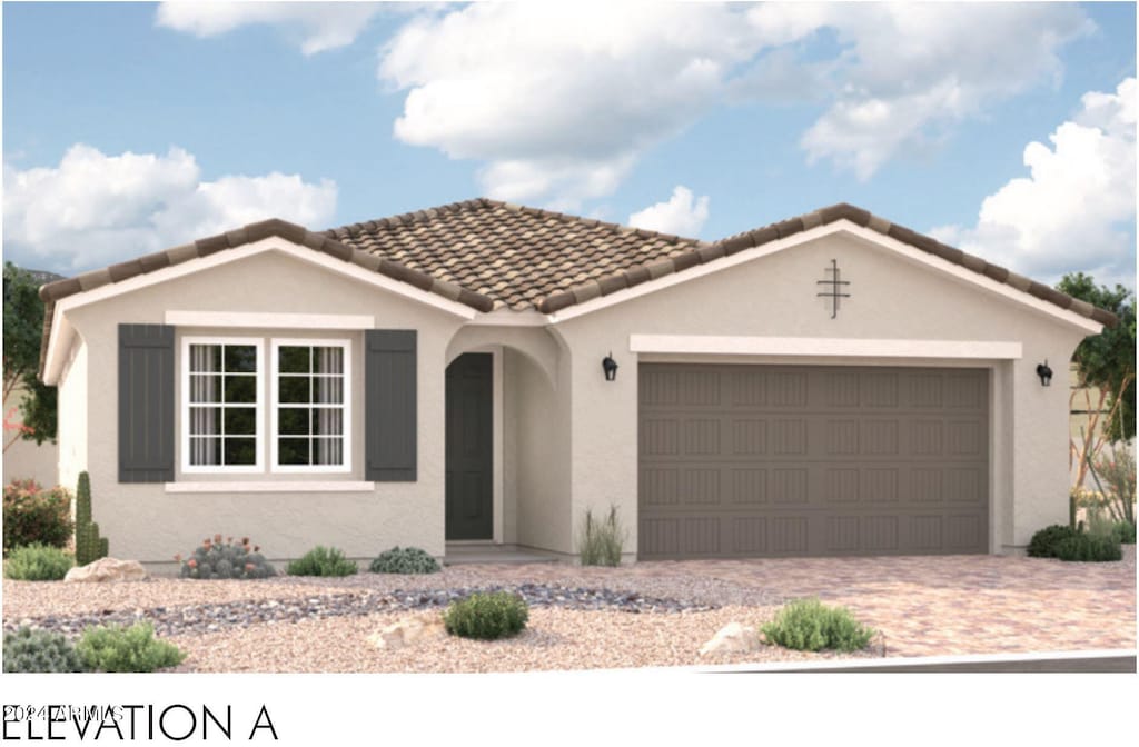 view of front of home featuring an attached garage, stucco siding, decorative driveway, and a tiled roof