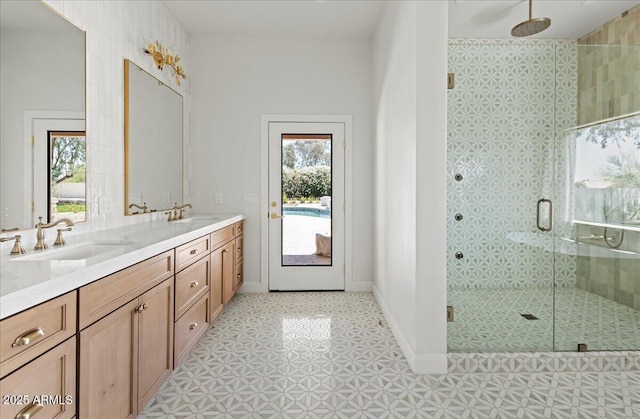 10755 E Cholla Ln, Scottsdale, AZ 85259 - full bath featuring a shower stall, double vanity, tile patterned floors, and baseboards