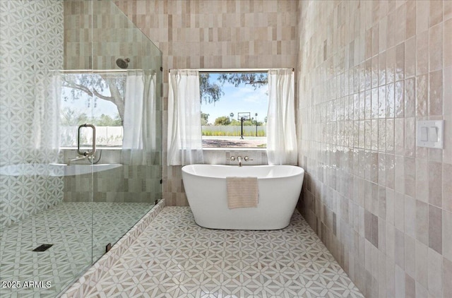 10755 E Cholla Ln, Scottsdale, AZ 85259 - bathroom featuring tile walls, a stall shower, and a freestanding tub
